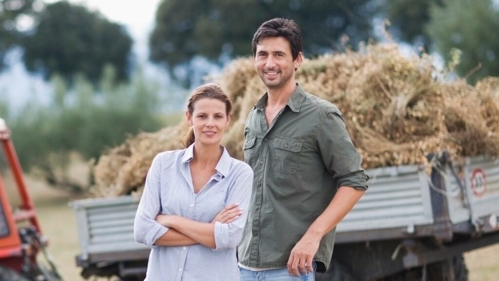 Happy young farmer couple